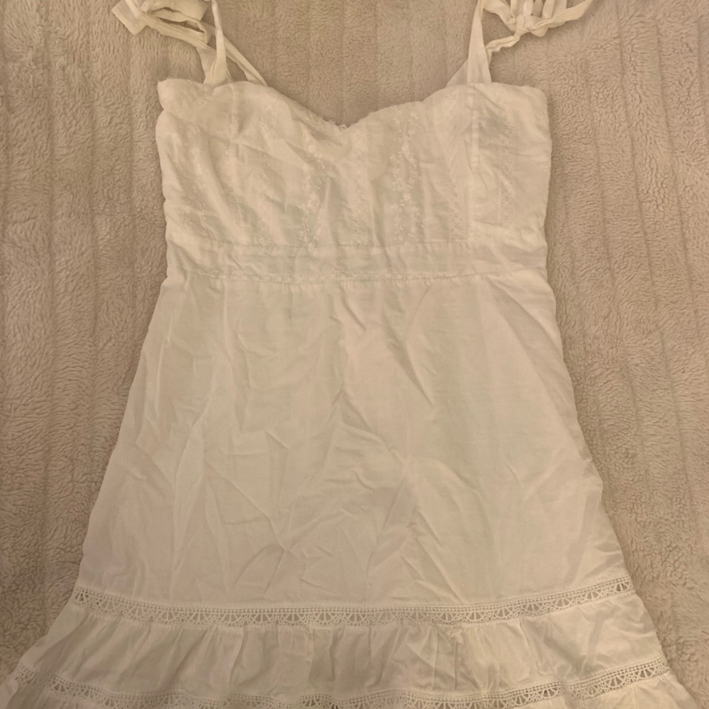 White Sleeveless Dress with Ruffle Hem